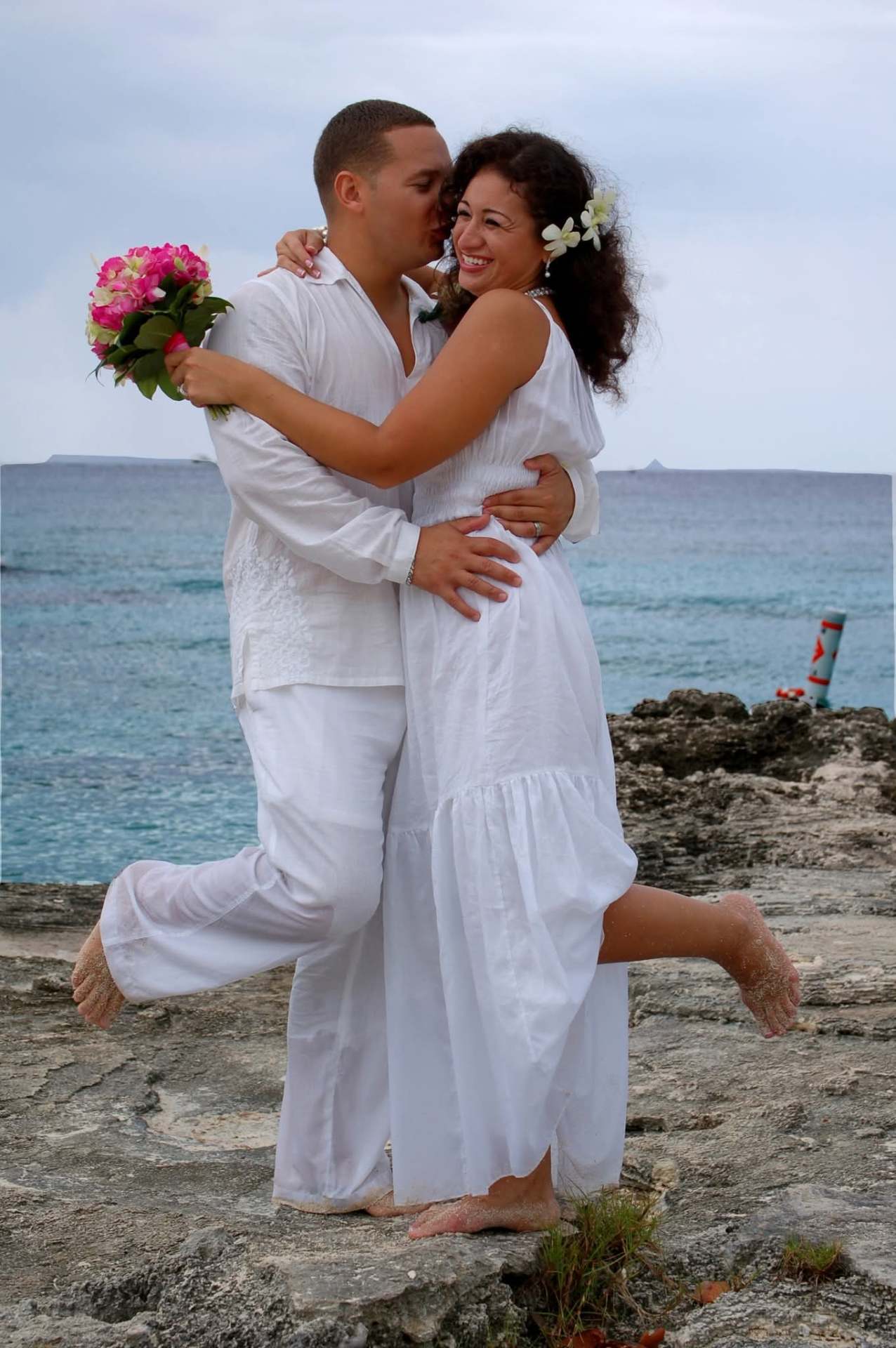 Eric and Haydee on the rocks by the sea, Grand Cayman